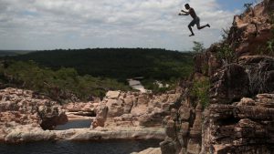 A boy dives inside the Roncador river, ahead of World Water Day, in Bahia, Brazil
