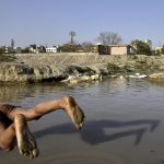 A child jumps in to the Shahdara lake, which has been turned into a garbage dump over the years, in East Delhi. Data available with the Delhi government says there are over 1,000 water bodies in the capital but due to encroachment and urbanisation, nearly 80% just exist on paper, say activists