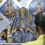 A devotee offering prayers to an idol of Durga mata in Ludhiana