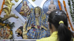A devotee offering prayers to an idol of Durga mata in Ludhiana