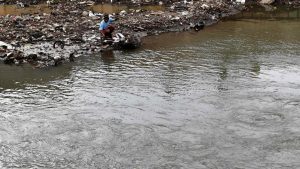 A man fishes along a river bank in Jakarta on March 21, 2017, on the eve of World Water Day. International World Water Day is marked annually on March 22 to focus global attention on the importance of water