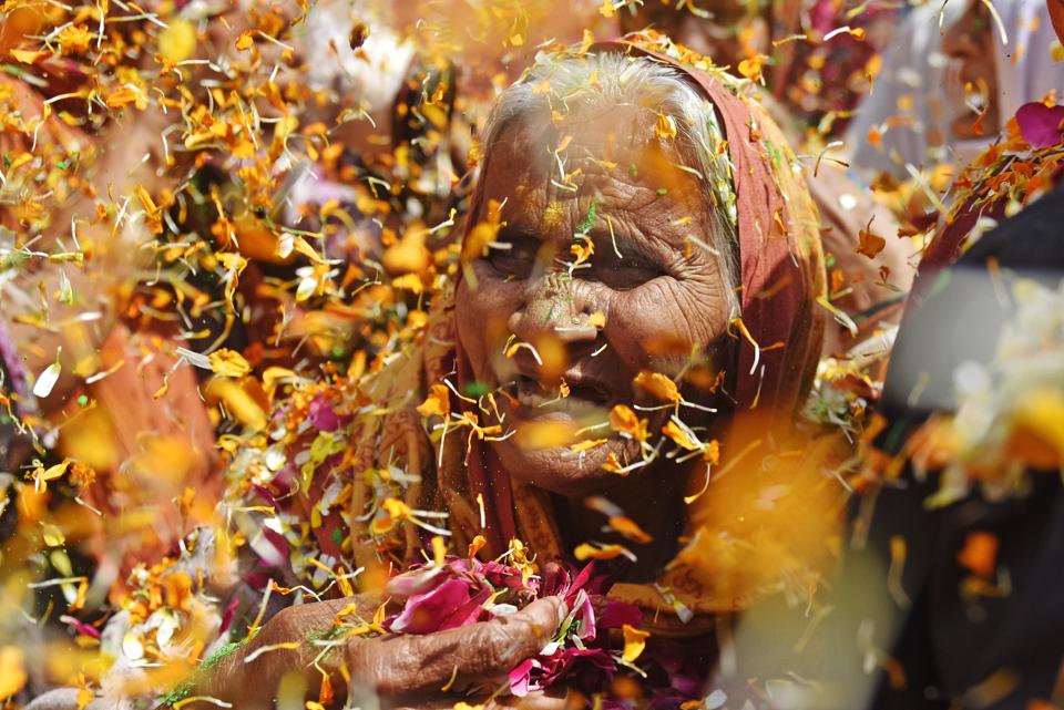 A widow participates in a celebration of the Holi festival at Gopinath temple,Vrindavan Thousands of Hindu widows, shunned and ignored by their own families, marked the Hindu spring festival of colours