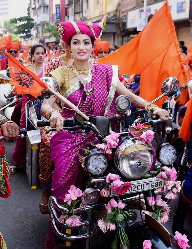 A woman participates in a community parade (Shobha Yatra) to mark Gudi Padwa, the Maharashtrian new year, in Mumbai on March 28, 2017