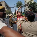 A woman scuffles with police during a rally marking the International Women’s Day in New Delhi, India, on March 8, 2017
