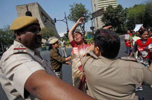 A woman scuffles with police during a rally marking the International Women’s Day in New Delhi, India, on March 8, 2017