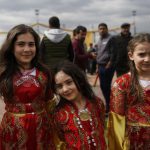Children in traditional Kurdish clothing, pose for the photographer during the Newroz celebration, in Diyarbakir, southeastern Turkey. Thousands celebrated the Newroz festival in Istanbul and in Diyarbakir, a mainly Kurdish city in a region where Kurdish militants regularly clash with government forces. In Turkey, the spring festival traditionally serves as an occasion to demand more rights for the Kurdish minority