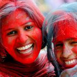 College students apply gulal on each others face during the Holi celebrations in Ranchi