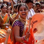 Happy faces all around as women dressed in traditional Maharashtrian attires play drums at Girgaum