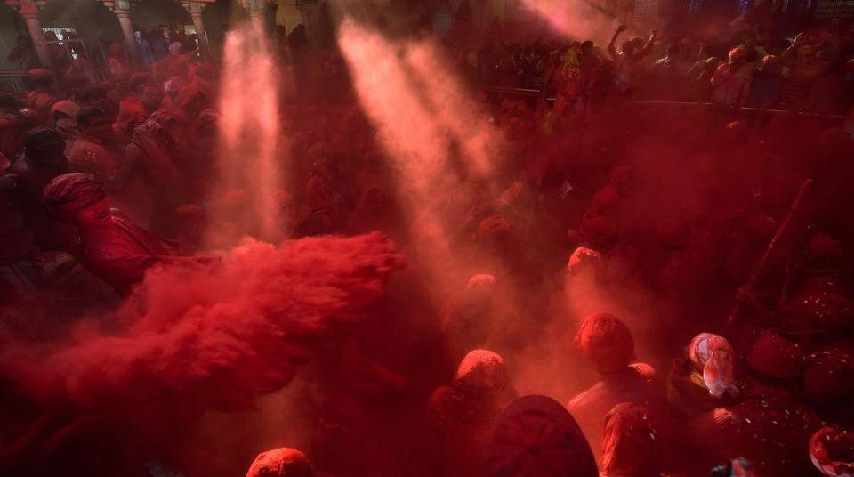 Hindu men playing with gulal at Radha Rani temple in Barsana