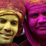 Indian villagers smear colours during the Lathmar Holi festival at the Nandji Temple in Nandgaon, some 120 kms from New Delhi