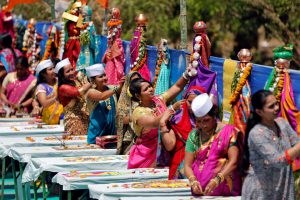 People perform a ritual as part of celebrations to mark the Gudi Padwa festival, the beginning of the Maharashtrian New Year, in Ahmedabad on March 28, 2017