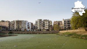 Shamshi lake facing residential buildings in Mehraulli