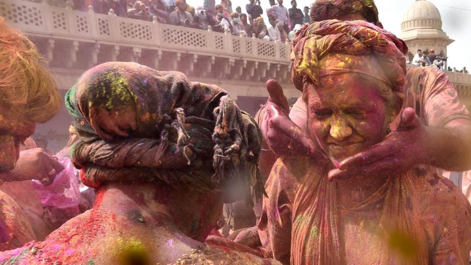 The traditional ‘Lathamar Holi’ started with pomp at Barsana village, as couples celebrated the colourful festival with utmost zeal amid a tight security put in place by district authorities