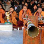 Tibetan Buddhist monks blow ceremonial horns during a special morning prayer session on the third day of ‘Losar’, or Tibetan New Year, in Dharamsala