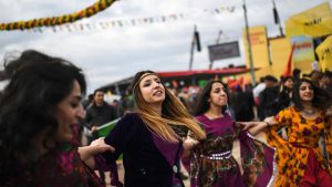 Women dance as Turkish Kurds during Newroz celebrations at Diyarbakir, southeastern Turkey. The annual event, which received official permission, took place under heavy security ahead of an April 16 referendum as the authorities pursue their fight against outlawed Kurdish militants