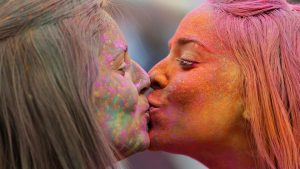 Women kiss during the Indian inspired Holi Festival in Burgos, north of Spain.