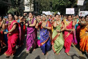 Women perform as they participate in a community parade (Shobha Yatra) to mark the Gudi Padwa festival, the beginning of the Maharashtrian New Year, in Mumbai on March 28, 2017
