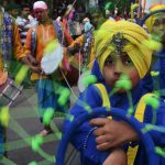 Young sikhs performs 'Gatka', an ancient form of Sikh martial art during a procession through the streets of Anandpur Sahib