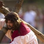 A Christian devotee re-enacts the crucifixion of Jesus Christ