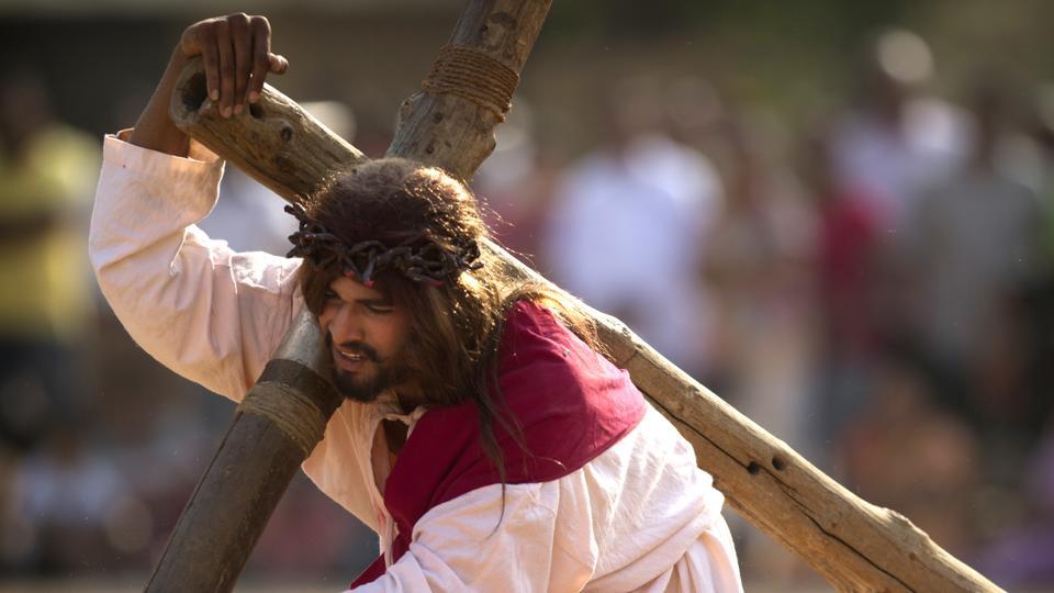 A Christian devotee re-enacts the crucifixion of Jesus Christ