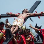 A Philippine Christian devotee reacts in pain while nailed to a cross during a re-enactment of the Crucifixion of Christ. While some say ‘good’ means holy, others say that it is a modification of ‘God Friday.’