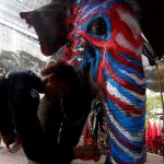 A Thai mahout paints an elephant in celebration of the Songkran water festival in Ayutthaya province, north of Bangkok, Thailand, on April 11, 2017