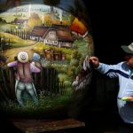 A local artist paints a two-metre-high Easter egg in the traditional naive art style in Koprivnica, Croatia, March 9, 2017. The project, which started ten years ago, involves painters decorating two-metre-tall polyester eggs, which are then sent to cities in the country and abroad to be displayed in public squares in time for Easter festivities