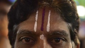 A man sports tilak on the occasion of Karaga
