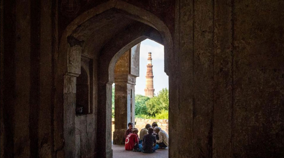 A view of a city landmark -- the Qutub Minar -- from one of the mausoleum’s archways. Like many of the city’s medieval monuments, Adham Khan’s mausoleum stands with its original intent and identity replaced by a newer, colloquial one in the minds of most locals and visitors, much like the ever changing city of Delhi.