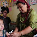 An anganwadi worker conducts a health checkup on a child in Bhopal. Anganwadis have been at the forefront of vaccination drives including the massive effort made towards vaccination against polio. As no new cases of polio were identified in India in the last two years, it is an effort that has come to fruition