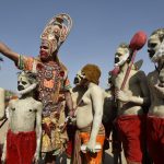 Artists dressed as lord Hanuman takes a selfie during a procession celebrating Ram Navami in New Delhi