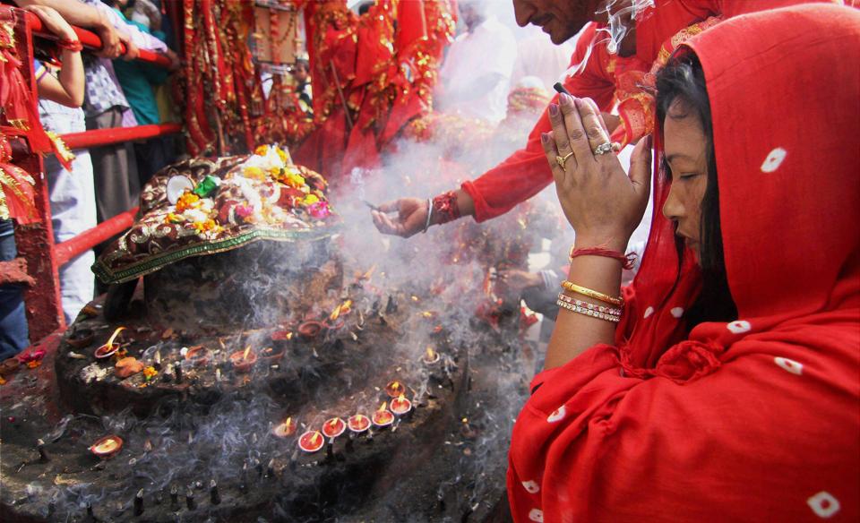 Devotees pray at the historical Goddess Kali temple on the last day of Navratri festival