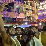 Devotees take selfies outside the Dharmaraya Swamy Temple in Bengaluru