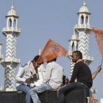Hindu youth sit atop a truck before the start of the procession from Delhi’s Ramlila Maidan to Karol Bagh