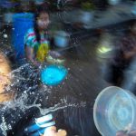 Locals take part in a water fight at Songkran Festival celebrations in Bangkok