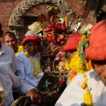 Nepalese Hindu devotees carry a statue of the Hindu god Bhairav