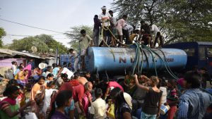 People seen filling drinking water from a tanker at a slum during a water crisis in Chanakyapuri, New Delhi. According to a WHO charter, clean water will control the spread of cholera, typhoid, dysentery which affect the our population, especially the rural poor in large numbers.