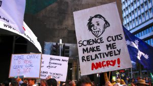 Protesters hold placards and banners as they participate in the March for Science rally on Earth Day, in central Sydney, Australia.