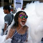 Revellers react at a foam party during Songkran Festival celebrations in Bangkok. Major streets are closed to traffic as they become the center for such foam and water fight parties