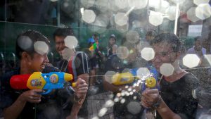 Revellers take part in a water fight at Songkran Festival marking the Thai new year celebrations in Bangkok streets on April 13, 2017. April being the hottest month of the year sees the entire country go bananas in friendly water fights and street parties that last nearly a week
