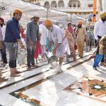 SGPC workers and devotees roll out mats and cool the floor with water and wipers in the parikarma (circumambulation) of the Golden Temple as the summer is already close to its peak in Amritsar on Friday, April 21.