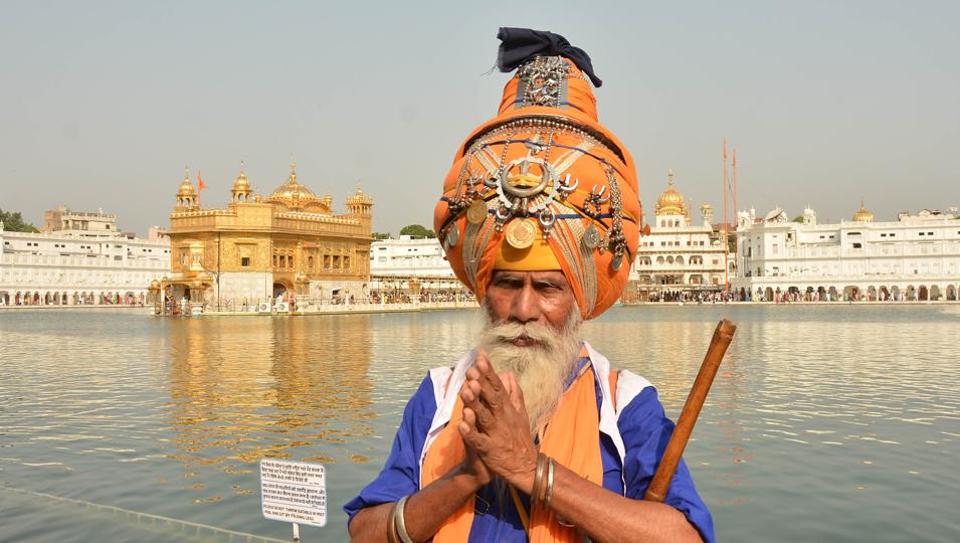 A Sikh devotee paying obeisance at Golden Temple on the occasion of martyrdom anniversary of Sikh Guru Arjan Dev in Golden Temple in Amritsar