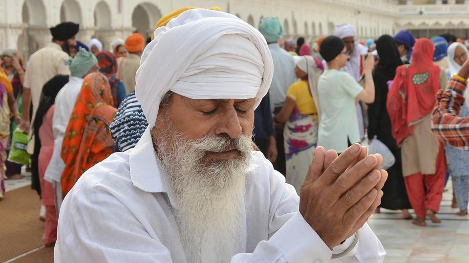 A Sikh devotee paying obeisance at Golden Temple on the occasion of martyrdom anniversary of Sikh Guru Arjan Dev in Golden Temple in Amritsar