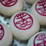 Buns are stamped with Chinese characters which read 'Peace Safe' during the annual Cheung Chau bun festival in Hong Kong. Tens of thousands gathered in Hong Kong for one of its most colourful festivals, a whirlwind of music and costume culminating in a dramatic climb up a precipitous