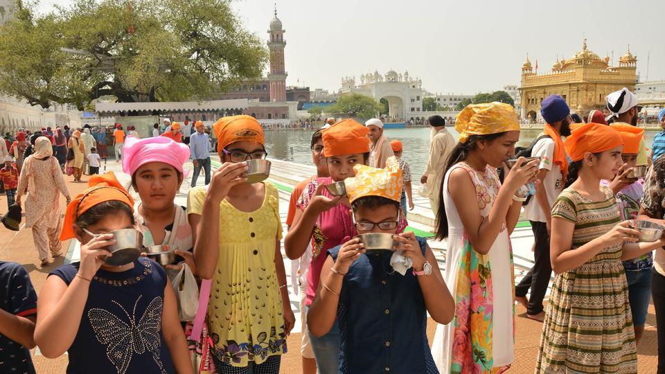 Devotees at Golden Temple on the occasion of martyrdom anniversary of Sikh Guru Arjun Dev in Amritsar