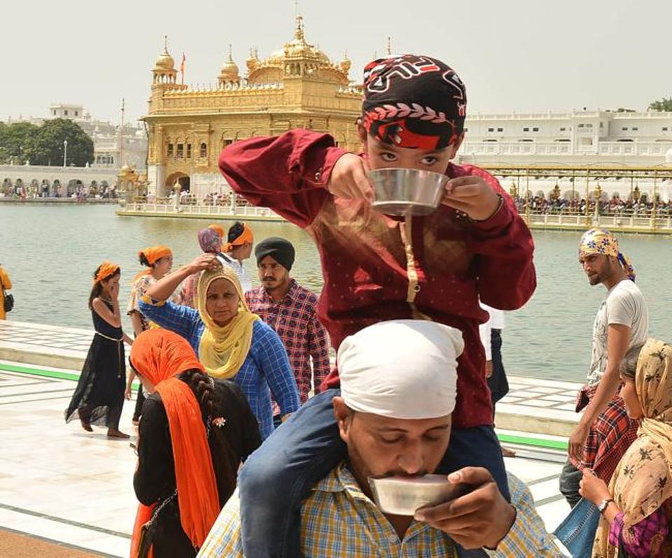 Devotees at Golden Temple on the occasion of martyrdom anniversary of Sikh Guru Arjun Dev in Amritsar