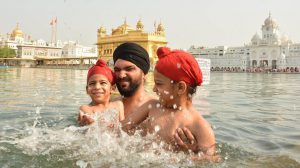Devotees taking holy dip and paying obeisance at Golden Temple on the occasion of martyrdom anniversary of Sikh Guru Arjan Dev in Amritsar