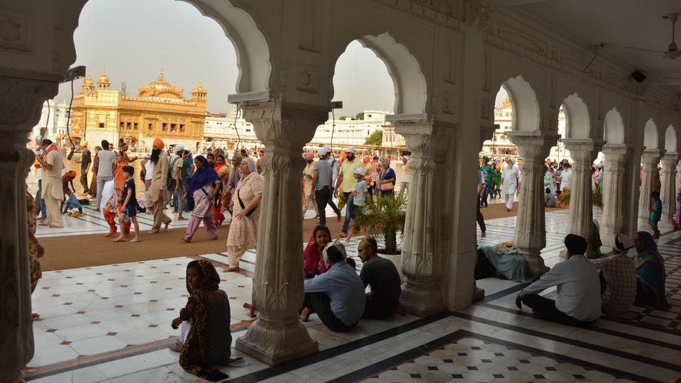Devotees taking paying obeisance at Golden Temple on the occasion of martyrdom anniversary of Sikh Guru Arjan Dev in Amritsar