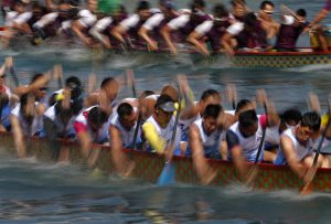 Dragon boat teams compete during the race in Hong Kong