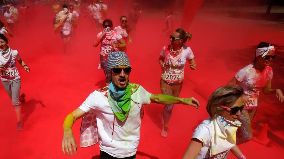 Participants compete during the Colour Run 2017. The Color run is an event series and five kilometre paint race that is owned and operated by The Color Run LLC, a for-profit company.